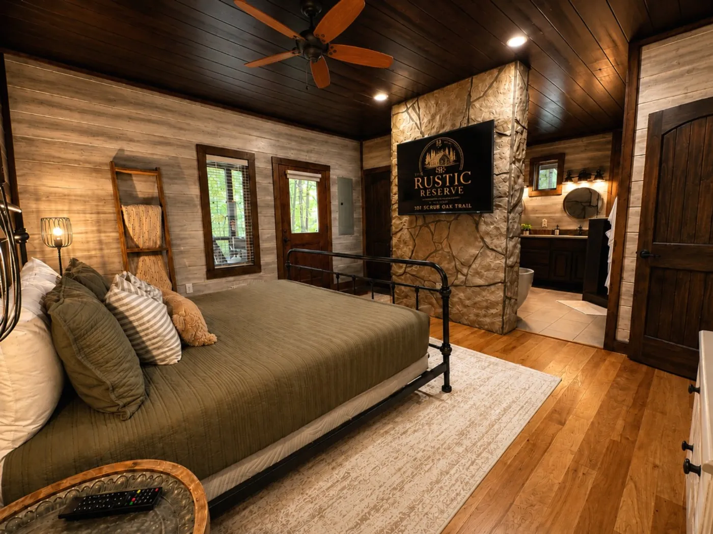 Private king bedroom with a stone fireplace