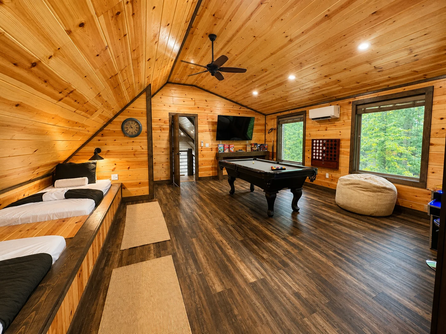 Loft beds and game room at The Rustic Reserve